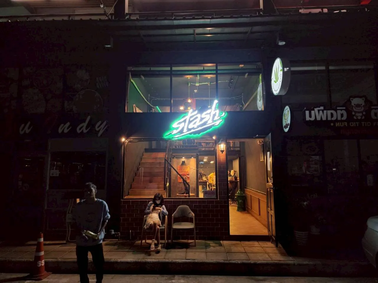 Stash BKK cannabis dispensary storefront at night in Bangkok
